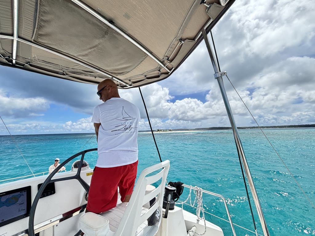 Kharim at Zephyr's helm, approaching the coast of Anguilla