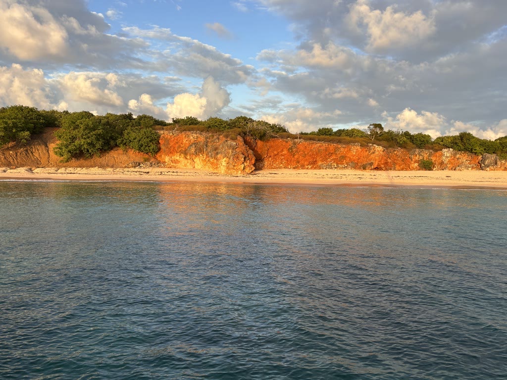 Tintamarre's ochre coastline in the late afternoon