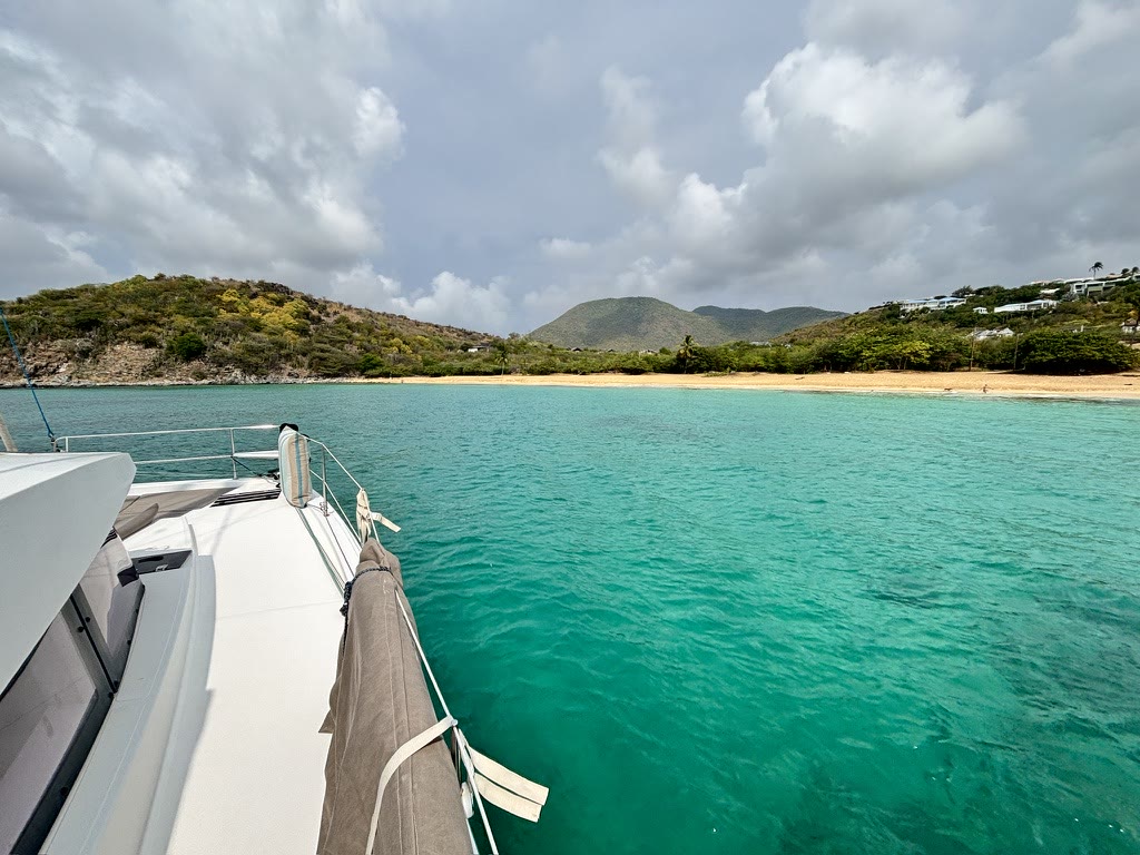Zephyr at anchor off Happy Bay, in turquoise water