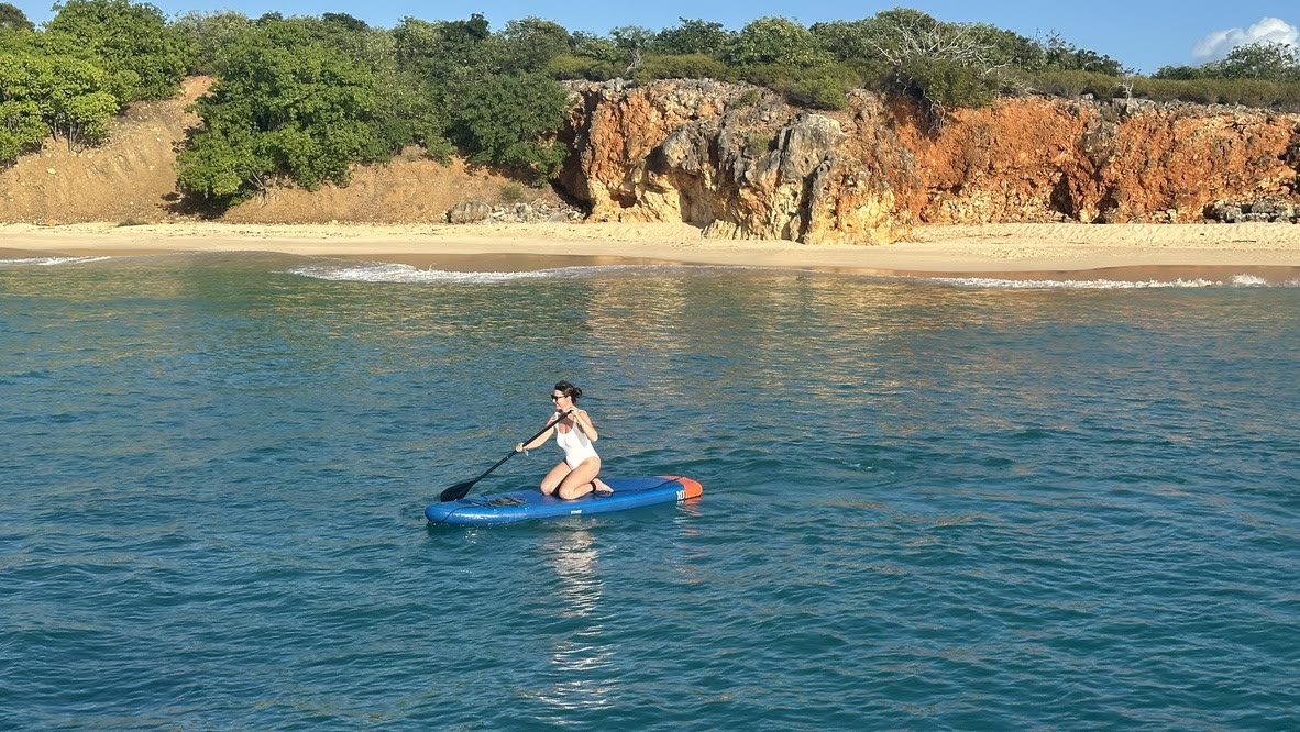 Paddleboarding along Tintamarre's ochre cliff